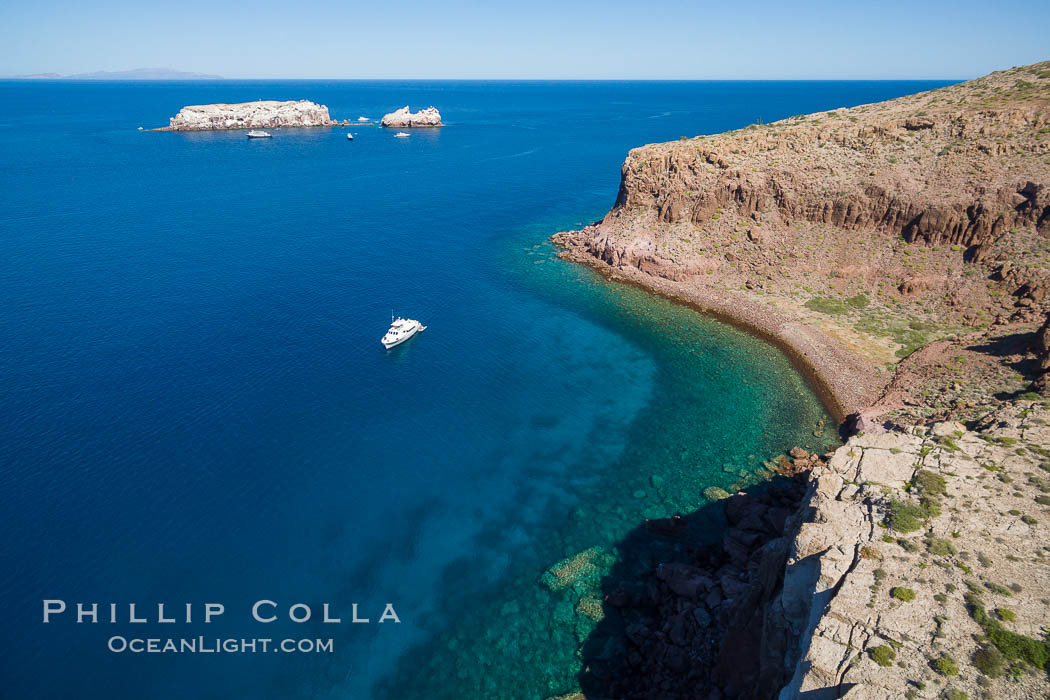 Boat Ambar III at Punta Maru, Isla Partida, Sea of Cortez. Los Islotes in the distance. Baja California, Mexico, natural history stock photograph, photo id 32389