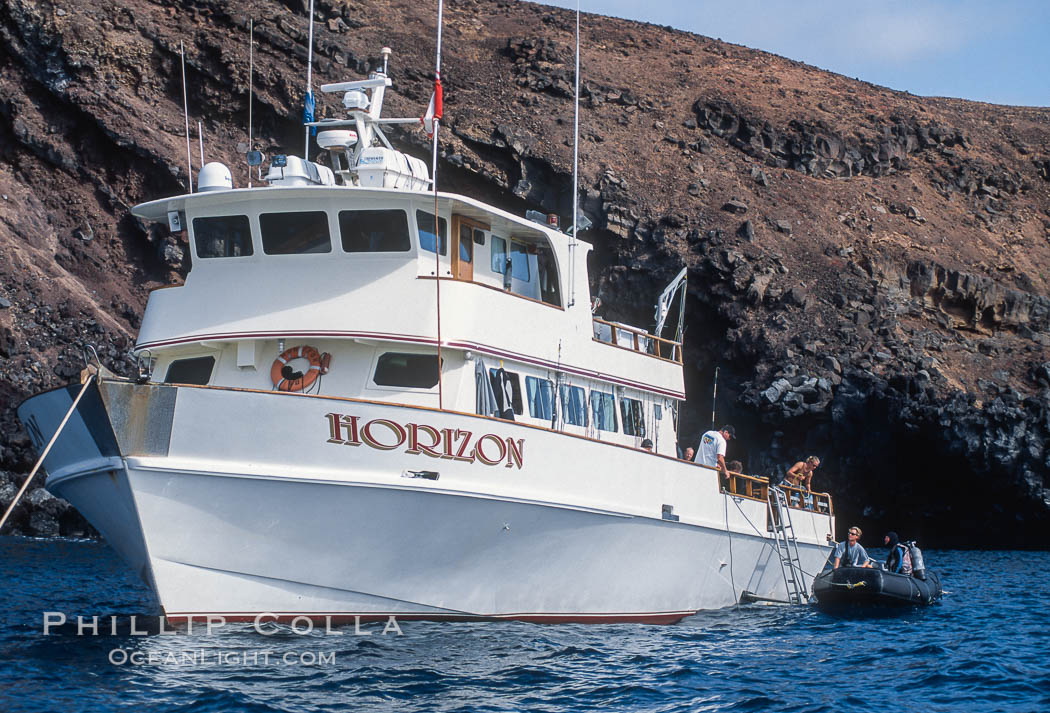 Boat Horizon loading diver into skiff. Guadalupe Island (Isla Guadalupe), Baja California, Mexico, natural history stock photograph, photo id 03716