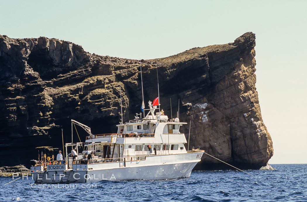 Boat Horizon at anchor in front of Battleship Point. Guadalupe Island (Isla Guadalupe), Baja California, Mexico, natural history stock photograph, photo id 09760