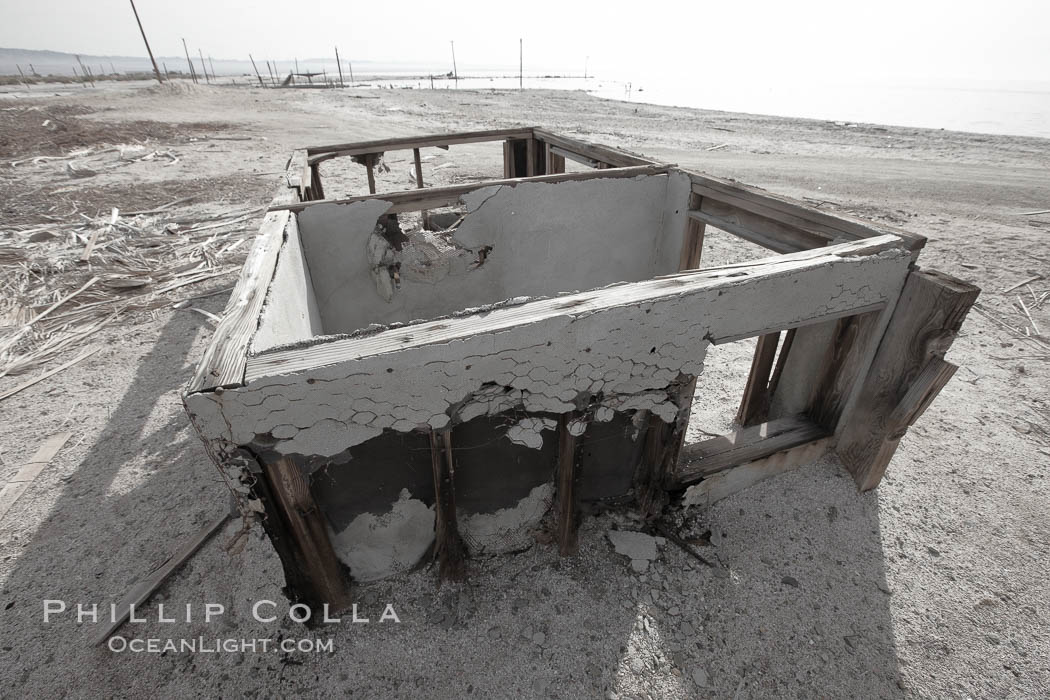 Bombay Beach, lies alongside and below the flood level of the Salton Sea, so that it floods occasionally when the Salton Sea rises.  A part of Bombay Beach is composed of derelict old trailer homes, shacks and wharfs, slowly sinking in the mud and salt. Imperial County, California, USA, natural history stock photograph, photo id 22494