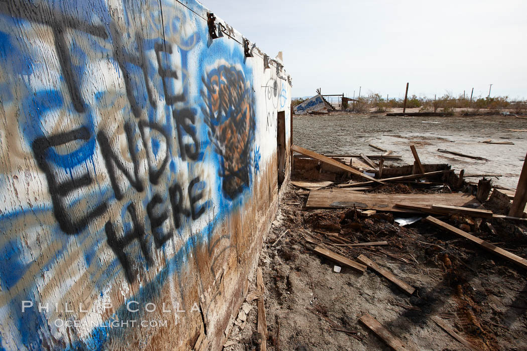 Bombay Beach, lies alongside and below the flood level of the Salton Sea, so that it floods occasionally when the Salton Sea rises.  A part of Bombay Beach is composed of derelict old trailer homes, shacks and wharfs, slowly sinking in the mud and salt. Imperial County, California, USA, natural history stock photograph, photo id 22489