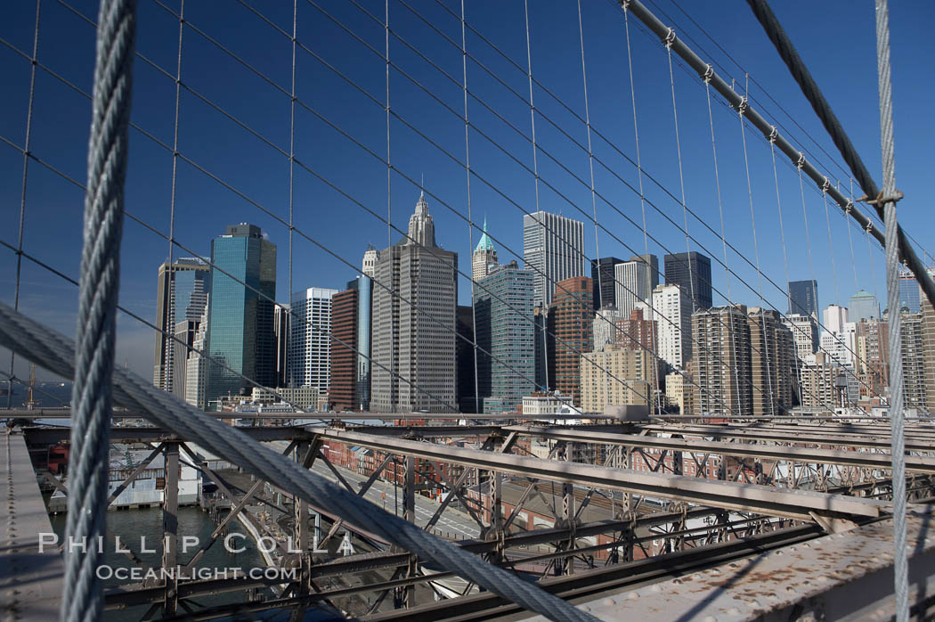 Lower Manhattan skyline viewed from the Brooklyn Bridge. New York City, USA, natural history stock photograph, photo id 11094