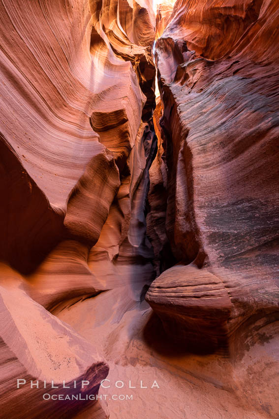 Canyon X, a spectacular slot canyon near Page, Arizona.  Slot canyons are formed when water and wind erode a cut through a (usually sandstone) mesa, producing a very narrow passage that may be as slim as a few feet and a hundred feet or more in height. USA, natural history stock photograph, photo id 36008