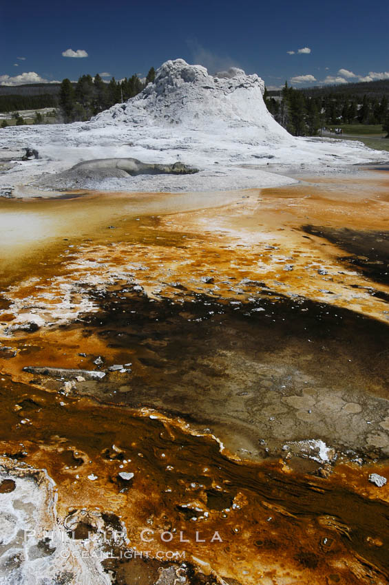 Sinter cone of Castle Geyser, estimated to be 5,000 - 15,000 years old.  Tortoise Shell Spring in foreground. Upper Geyser Basin. Yellowstone National Park, Wyoming, USA, natural history stock photograph, photo id 07211
