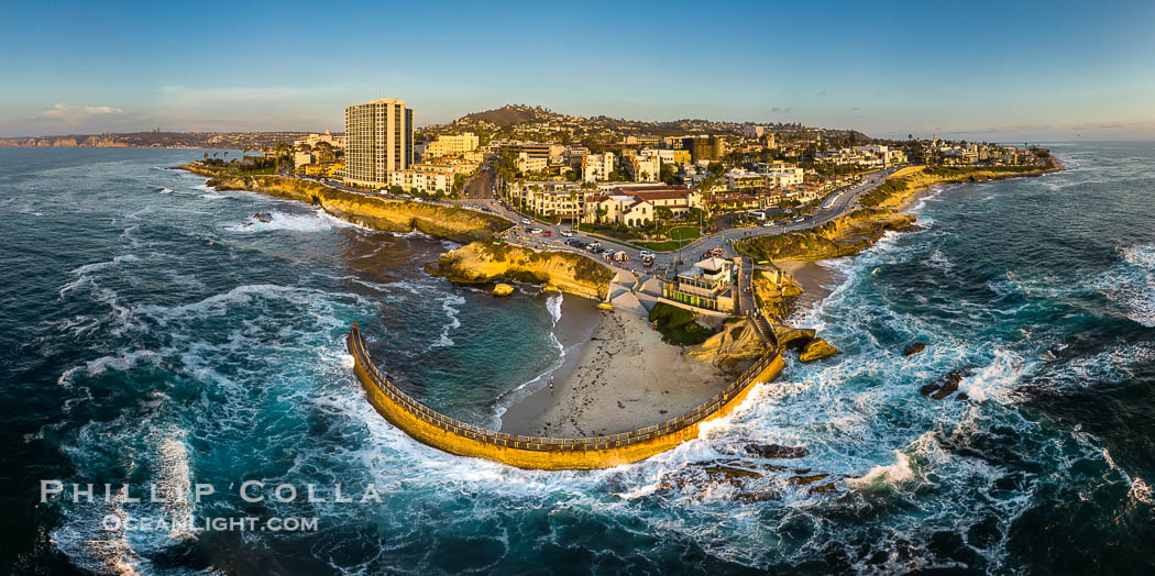 Childrens Pool Aerial Panoramic Photo at Sunset, people enjoying the sunset on the sea wall and the protected beach, Coast Boulevard in the foreground, Mount Soledad in the distance. La Jolla, California, USA, natural history stock photograph, photo id 38208