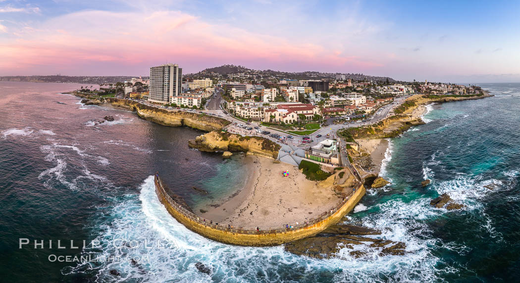 Childrens Pool seawall and Casa Cove aerial photo, La Jolla, California. Sunset. Aerial panoramic photograph