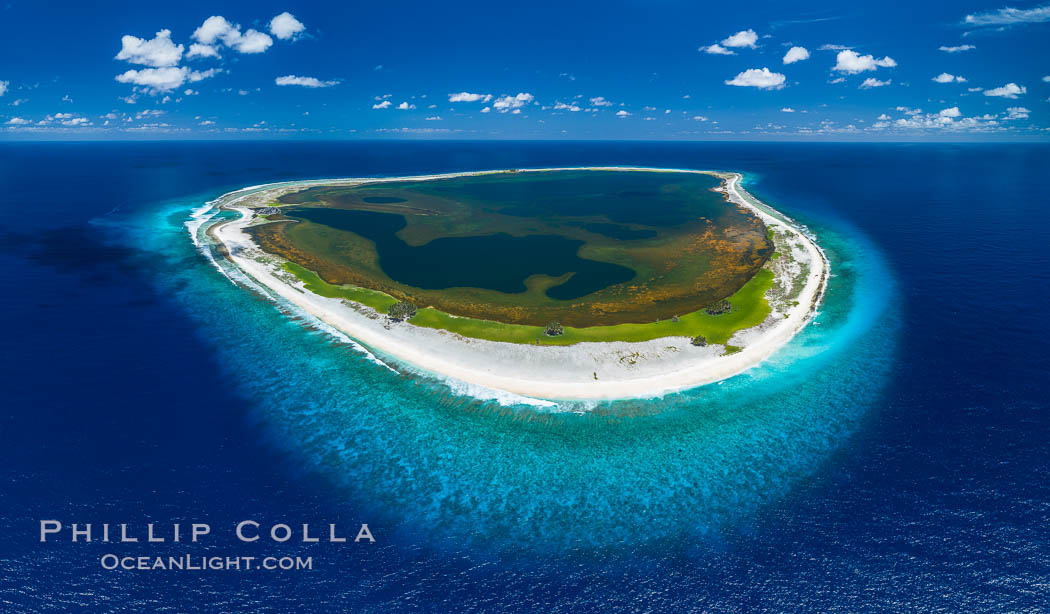 Aerial panorama of Clipperton Island, showing the entire atoll.  Clipperton Island, a minor territory of France also known as Ile de la Passion, is a small (2.3 sq mi) but  spectacular coral atoll in the eastern Pacific. By permit HC / 1485 / CAB (France)., natural history stock photograph, photo id 32888