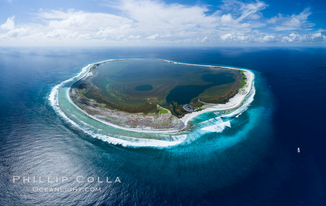Aerial panorama of Clipperton Island, showing the entire atoll.  Clipperton Island, a minor territory of France also known as Ile de la Passion, is a small (2.3 sq mi) but  spectacular coral atoll in the eastern Pacific. By permit HC / 1485 / CAB (France)., natural history stock photograph, photo id 32924