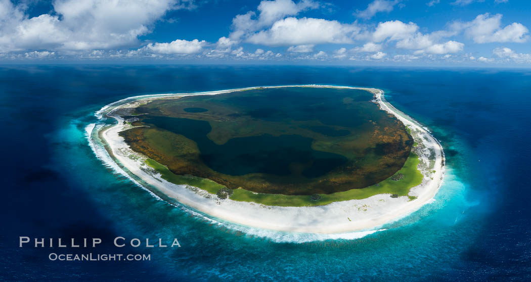 Aerial panorama of Clipperton Island, showing the entire atoll.  Clipperton Island, a minor territory of France also known as Ile de la Passion, is a small (2.3 sq mi) but  spectacular coral atoll in the eastern Pacific. By permit HC / 1485 / CAB (France)., natural history stock photograph, photo id 32871