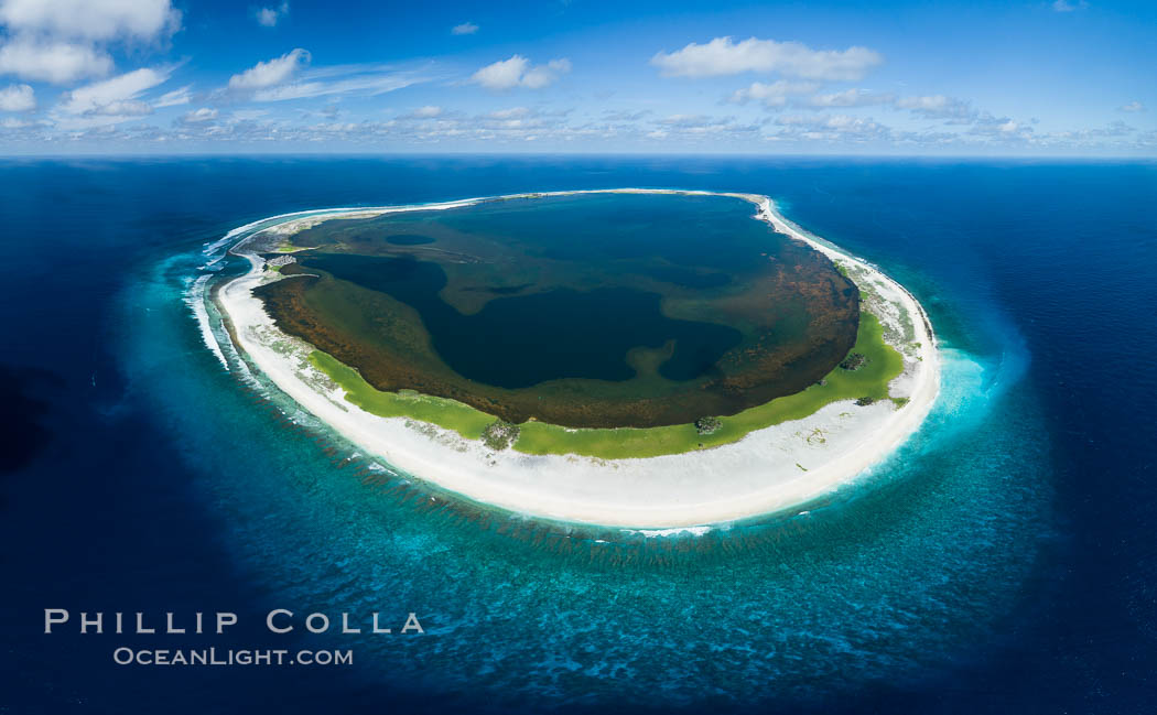 Aerial panorama of Clipperton Island, showing the entire atoll.  Clipperton Island, a minor territory of France also known as Ile de la Passion, is a small (2.3 sq mi) but  spectacular coral atoll in the eastern Pacific. By permit HC / 1485 / CAB (France)., natural history stock photograph, photo id 32849