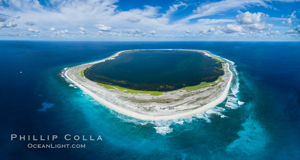 Aerial panorama of Clipperton Island, showing the entire atoll.  Clipperton Island, a minor territory of France also known as Ile de la Passion, is a small (2.3 sq mi) but  spectacular coral atoll in the eastern Pacific. By permit HC / 1485 / CAB (France)., natural history stock photograph, photo id 32893