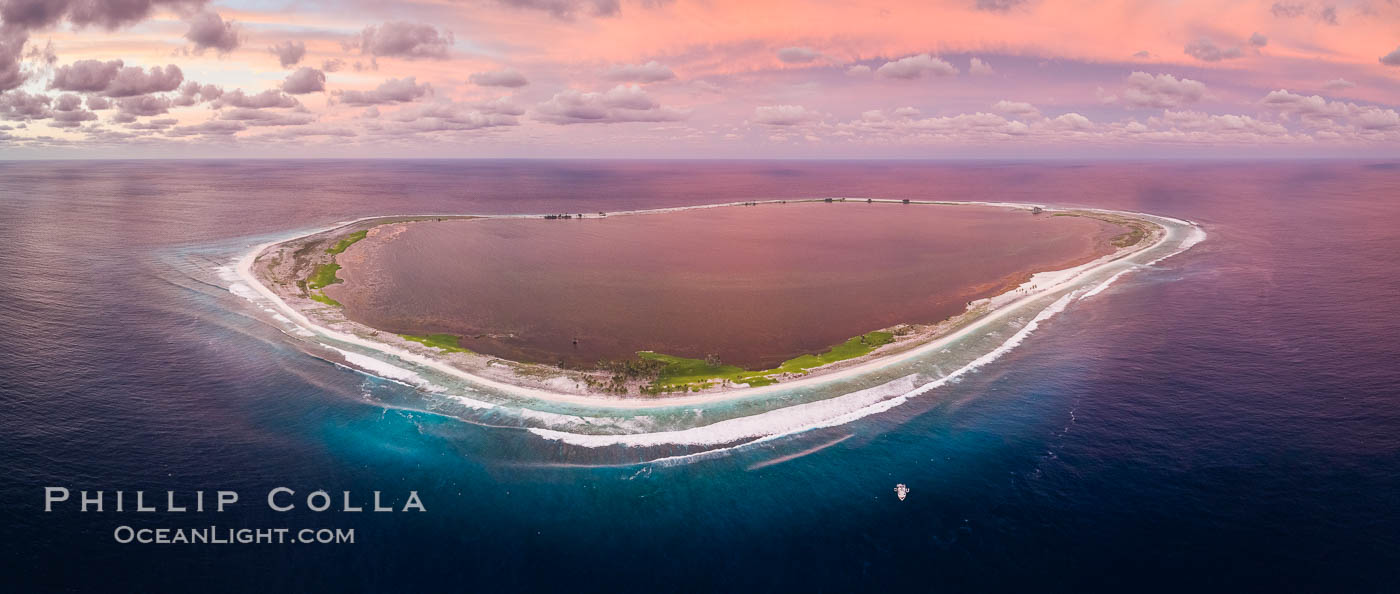 Sunset at Clipperton Island, aerial panoramic photo showing the entire atoll.  Clipperton Island, a minor territory of France also known as Ile de la Passion, is a small (2.3 sq mi) but  spectacular coral atoll in the eastern Pacific. By permit HC / 1485 / CAB (France)., natural history stock photograph, photo id 32934