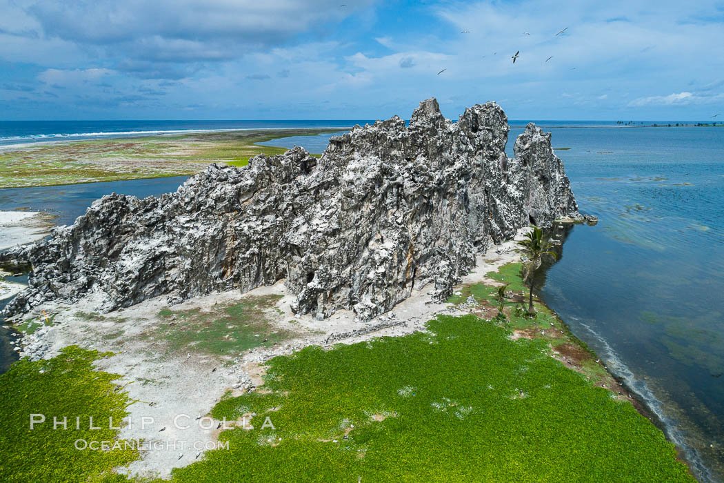 Clipperton Rock, a 95' high volcanic remnant, is the highest point on Clipperton Island, a spectacular coral atoll in the eastern Pacific. By permit HC / 1485 / CAB (France)., natural history stock photograph, photo id 32824