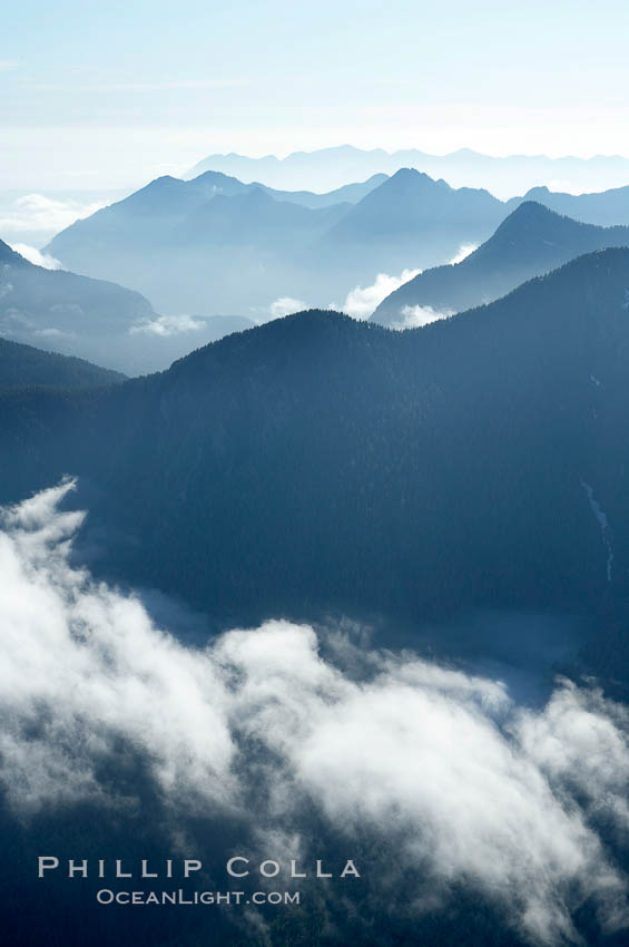 Coastal mountains and clouds, rising above Bedwell Sound (hidden by clouds) and Clayoquot Sound, near Tofino on the west coast of Vancouver Island. British Columbia, Canada, natural history stock photograph, photo id 21126