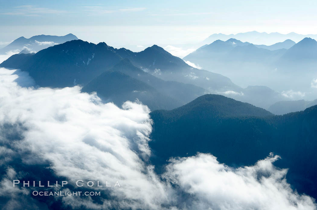 Coastal mountains and clouds, rising above Bedwell Sound (hidden by clouds) and Clayoquot Sound, near Tofino on the west coast of Vancouver Island. British Columbia, Canada, natural history stock photograph, photo id 21093