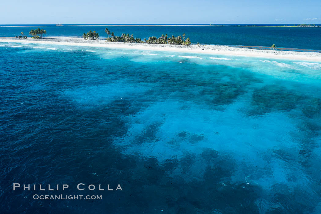 Coral Reef at Clipperton Island, aerial photo. Clipperton has healthy, beatiful coral reefs.  The white beaches are composed of white coralline rubble. Clipperton Island, a minor territory of France also known as Ile de la Passion, is a spectacular coral atoll in the eastern Pacific. By permit HC / 1485 / CAB (France)., natural history stock photograph, photo id 32896