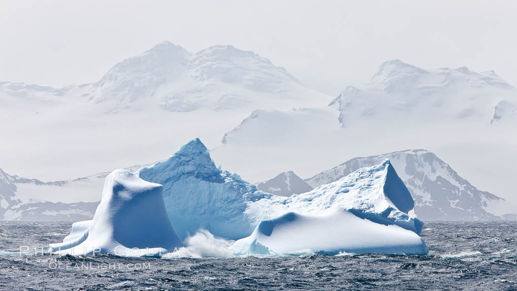 Coronation Island, is the largest of the South Orkney Islands, reaching 4,153' (1,266m) above sea level.  While it is largely covered by ice, Coronation Island also is home to some tundra habitat, and is inhabited by many seals, penguins and seabirds. Southern Ocean, natural history stock photograph, photo id 24849