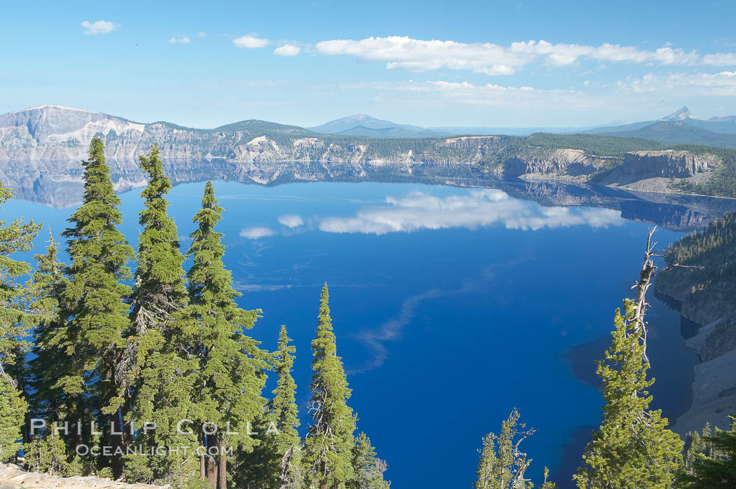 Crater Lake. Crater Lake is the six-mile wide lake inside the collapsed caldera of volcanic Mount Mazama. Crater Lake is the deepest lake in the United States and the seventh-deepest in the world. Its maximum recorded depth is 1996 feet (608m). It lies at an altitude of 6178 feet (1880m). Crater Lake National Park, Oregon, USA, natural history stock photograph, photo id 13934