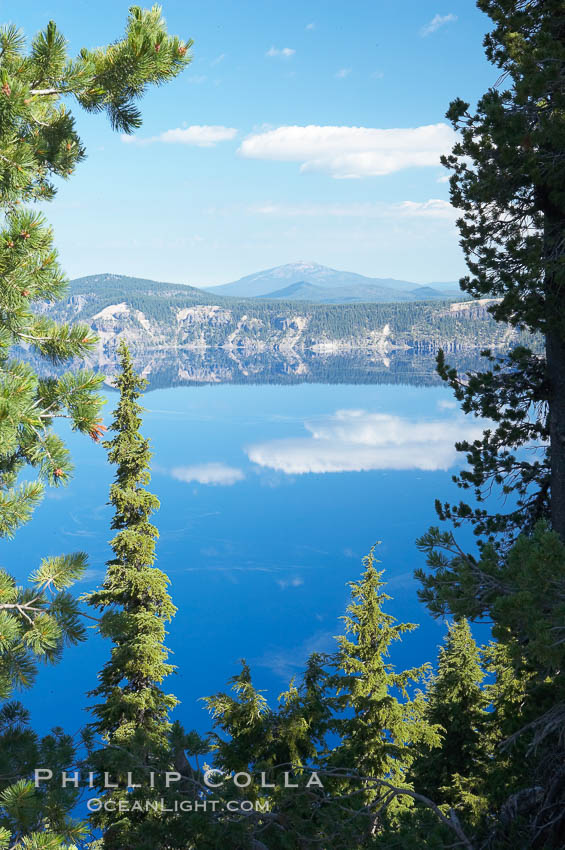 Crater Lake. Crater Lake is the six-mile wide lake inside the collapsed caldera of volcanic Mount Mazama. Crater Lake is the deepest lake in the United States and the seventh-deepest in the world. Its maximum recorded depth is 1996 feet (608m). It lies at an altitude of 6178 feet (1880m). Crater Lake National Park, Oregon, USA, natural history stock photograph, photo id 13938