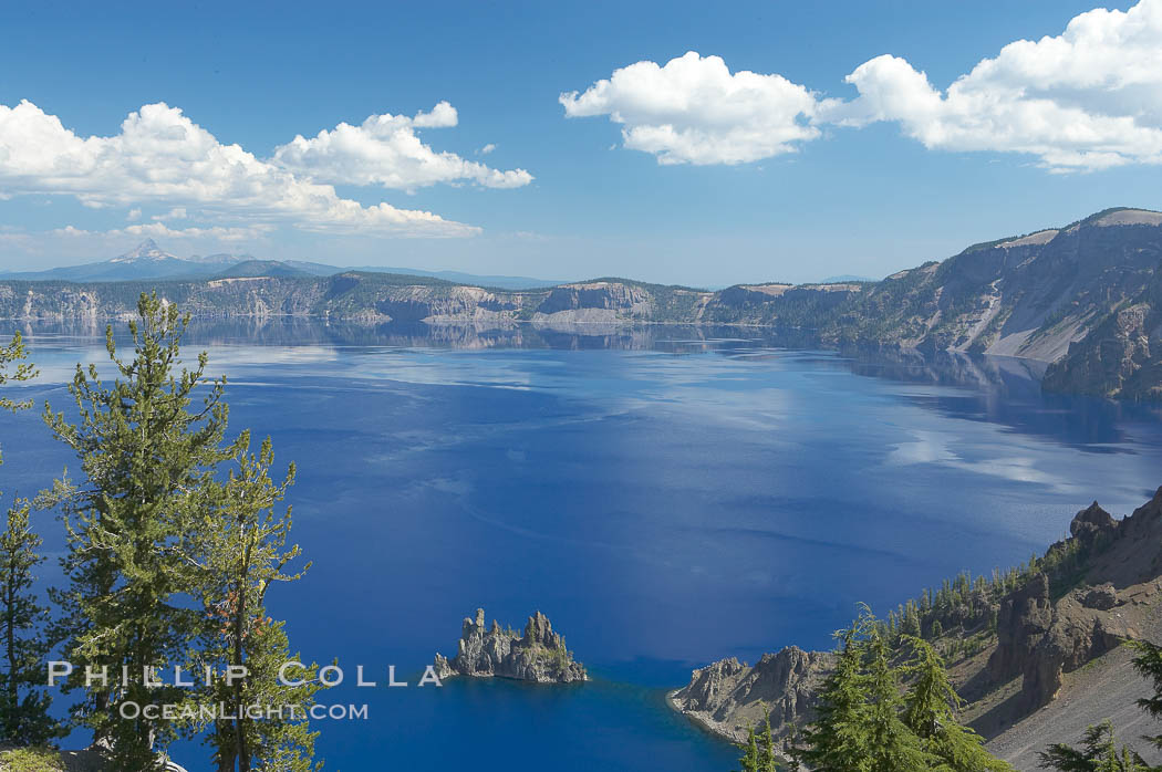 Crater Lake. Crater Lake is the six-mile wide lake inside the collapsed caldera of volcanic Mount Mazama. Crater Lake is the deepest lake in the United States and the seventh-deepest in the world. Its maximum recorded depth is 1996 feet (608m). It lies at an altitude of 6178 feet (1880m). Crater Lake National Park, Oregon, USA, natural history stock photograph, photo id 13932
