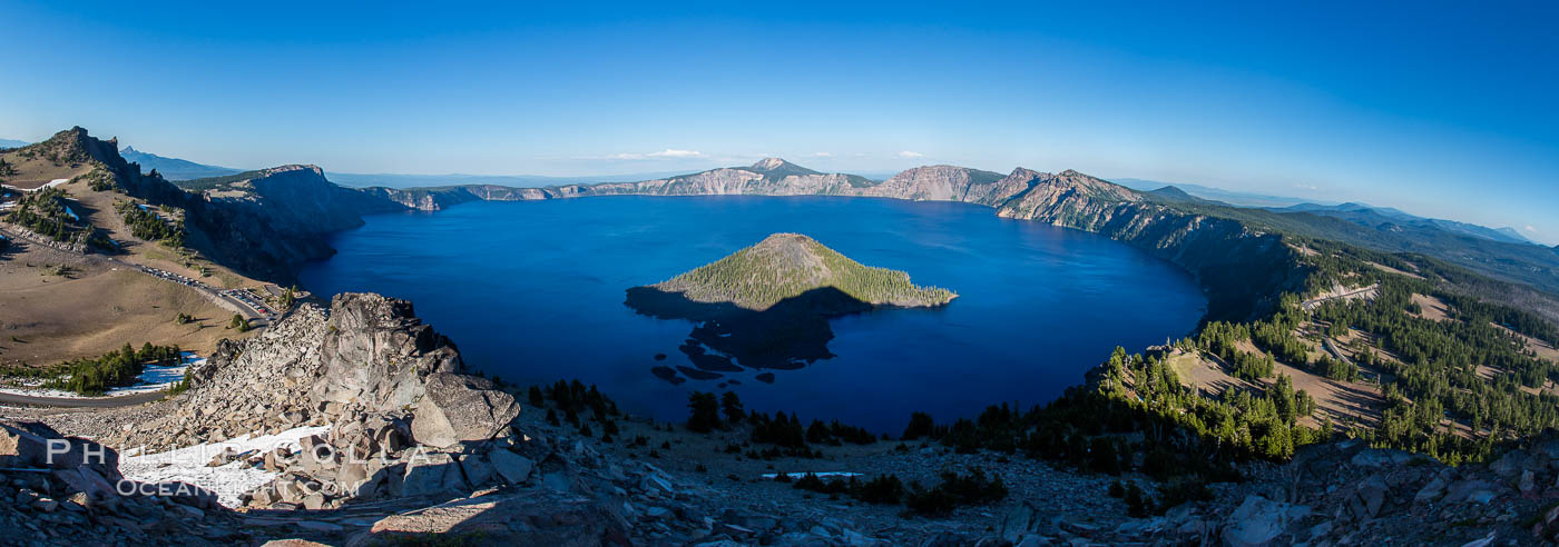 Panorama of Crater Lake from Watchman Lookout Station, panoramic picture. The Watchman Lookout Station No. 168 is one of two fire lookout towers in Crater Lake National Park in southern Oregon. For many years, National Park Service personnel used the lookout to watch for wildfires during the summer months. It is also a popular hiking destination because it offers an excellent view of Crater Lake and the surrounding area. USA, natural history stock photograph, photo id 28653