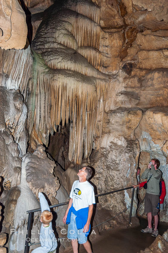 Visitors admire the Pipe Organ formation of calcite flowstone and cave curtains. Crystal Cave, Sequoia Kings Canyon National Park, California, USA, natural history stock photograph, photo id 09910