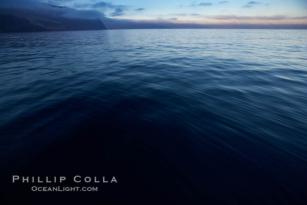 Dark water, clouds at days end, cliffs, sunset. Guadalupe Island (Isla Guadalupe), Baja California, Mexico, natural history stock photograph, photo id 21382