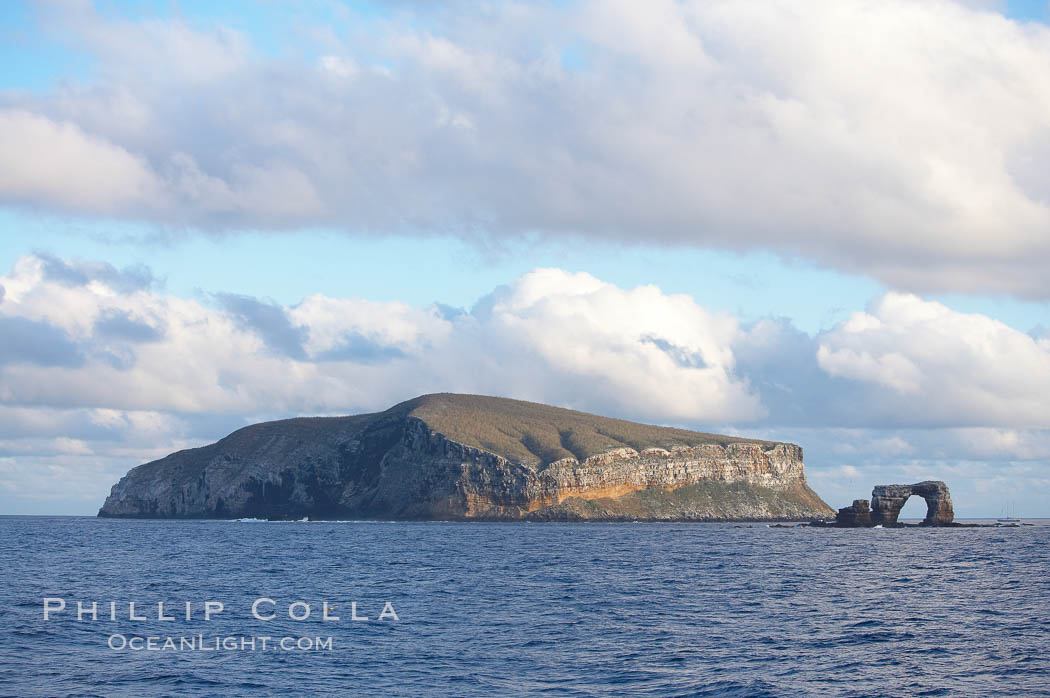 Darwin Island, with Darwins Arch on the right.  Darwin Island is the northernmost of the Galapagos Islands and is home to enormous numbers of seabirds. Ecuador, natural history stock photograph, photo id 16618