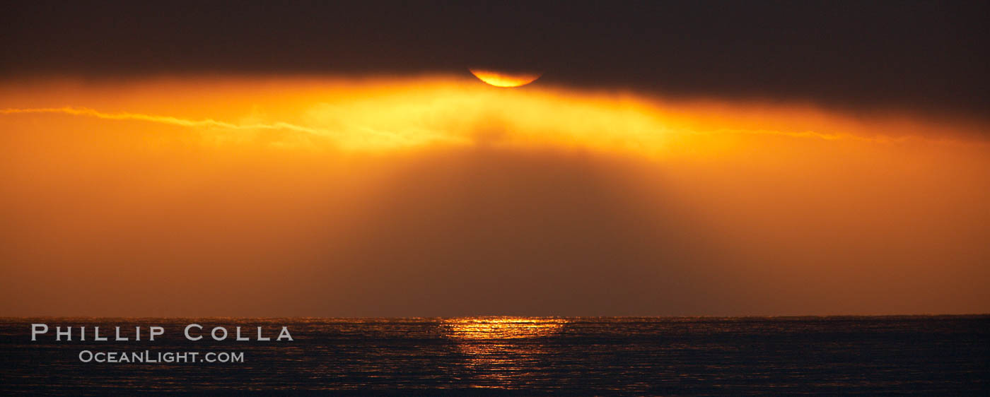 Dawn, sun peeks through morning clouds. Guadalupe Island (Isla Guadalupe), Baja California, Mexico, natural history stock photograph, photo id 21355