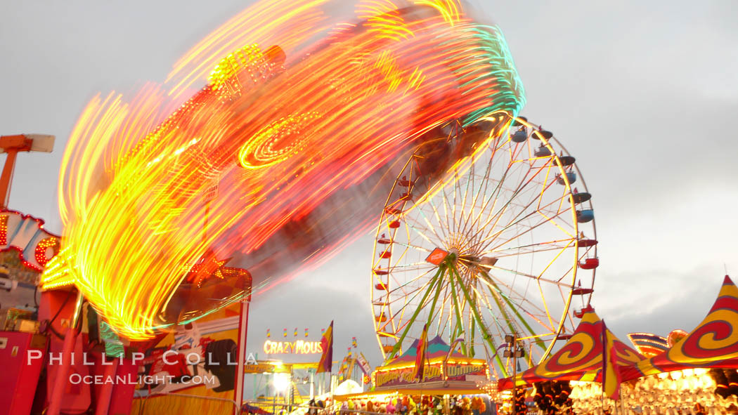 Ferris wheel and fair rides at sunset, blurring due to long exposure. Del Mar Fair, California, USA, natural history stock photograph, photo id 20873