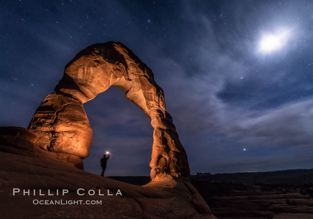 Delicate Arch with Stars and Moon, at night, Arches National Park (Note: this image was created before a ban on light-painting in Arches National Park was put into effect.  Light-painting is no longer permitted in Arches National Park). Utah, USA, natural history stock photograph, photo id 29285