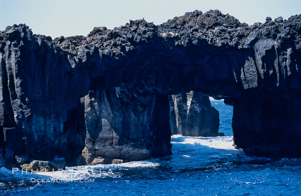 Arcos del Diablo (Devils Arches), a series of enormous volcanic arches that were originally lava tubes.  Some of the arches are exposed above water (seen here) while at least one that we discovered is entirely submarine (El Secreto del Vicki).  Weather side of Guadalupe Island (Isla Guadalupe). Baja California, Mexico, natural history stock photograph, photo id 09766