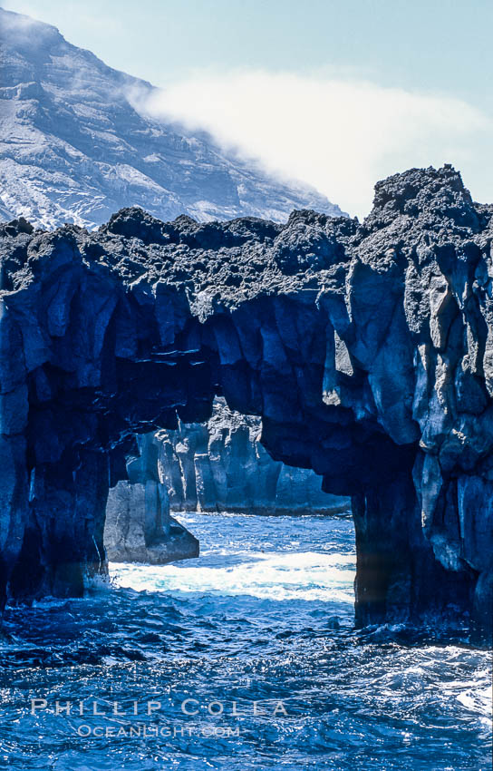 Arcos del Diablo (Devils Arches), a series of enormous volcanic arches that were originally lava tubes.  Some of the arches are exposed above water (seen here) while at least one that we discovered is entirely submarine (El Secreto del Vicki).  Weather side of Guadalupe Island (Isla Guadalupe). Baja California, Mexico, natural history stock photograph, photo id 09765