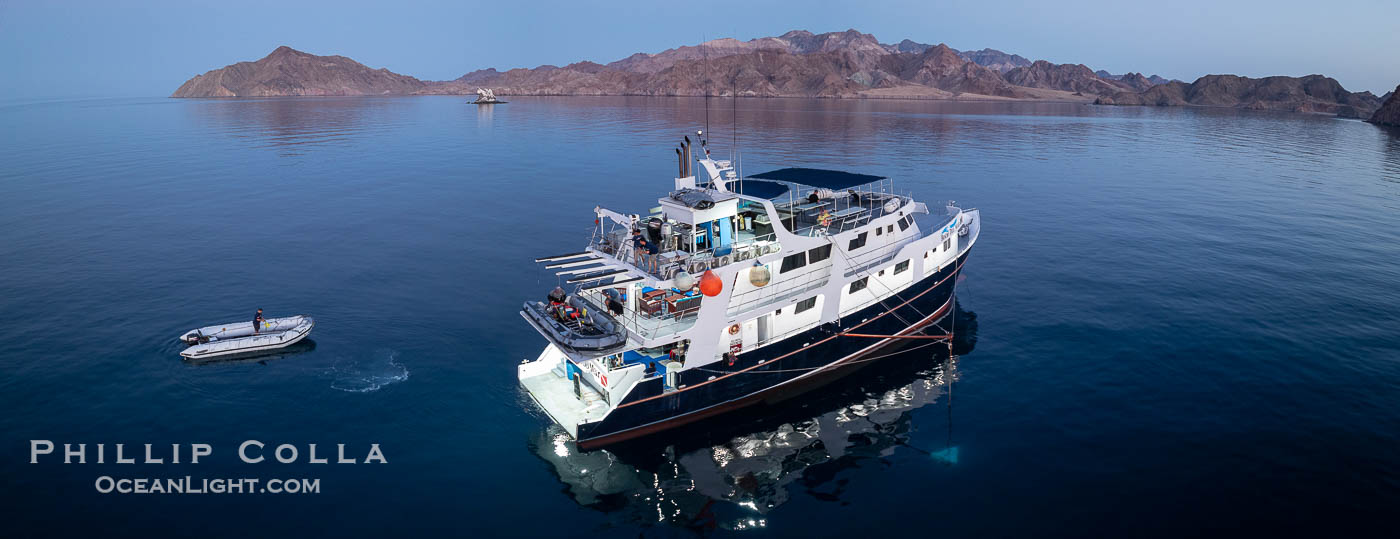 Dive boat Rocio del Mar anchored at  Isla Angel de la Guarda at Sunset, Aerial Photo, Sea of Cortez, Mexico.  Guardian Angel island is part of the Midriff Islands in Mexico's Sea of Cortez., natural history stock photograph, photo id 40367
