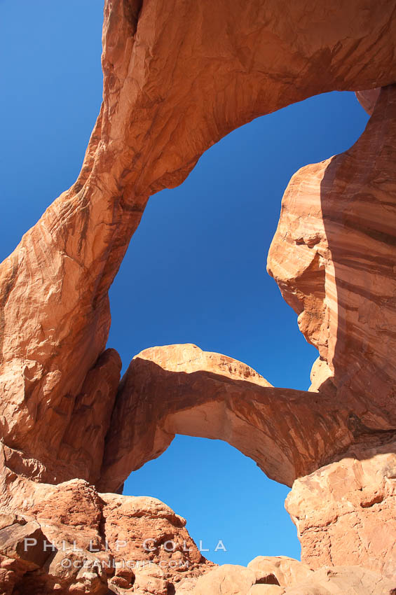 Double Arch, an amazing pair of natural arches formed in the red Entrada sandstone of Arches National Park. Utah, USA, natural history stock photograph, photo id 18183
