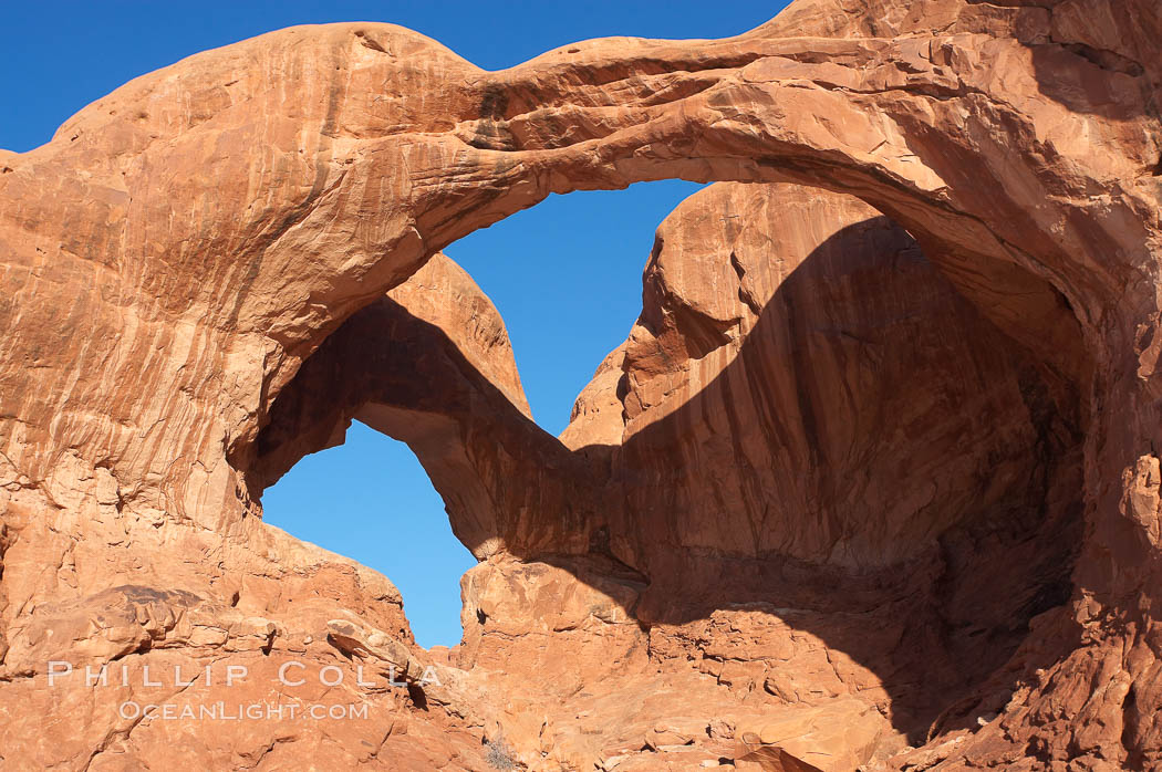Double Arch, an amazing pair of natural arches formed in the red Entrada sandstone of Arches National Park. Utah, USA, natural history stock photograph, photo id 18181