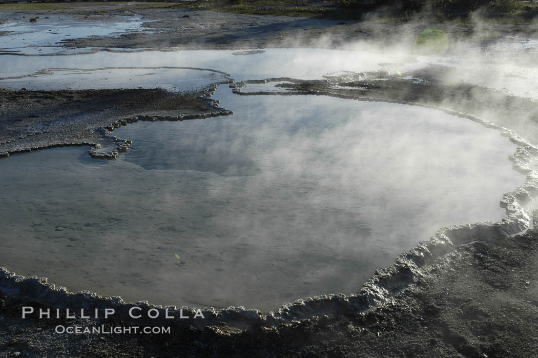 Steam rises from Doublet Pool. Upper Geyser Basin, Yellowstone National Park, Wyoming, USA, natural history stock photograph, photo id 07242