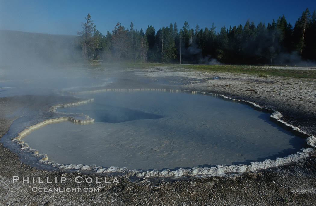 Steam rises from Doublet Pool. Upper Geyser Basin, Yellowstone National Park, Wyoming, USA, natural history stock photograph, photo id 07243