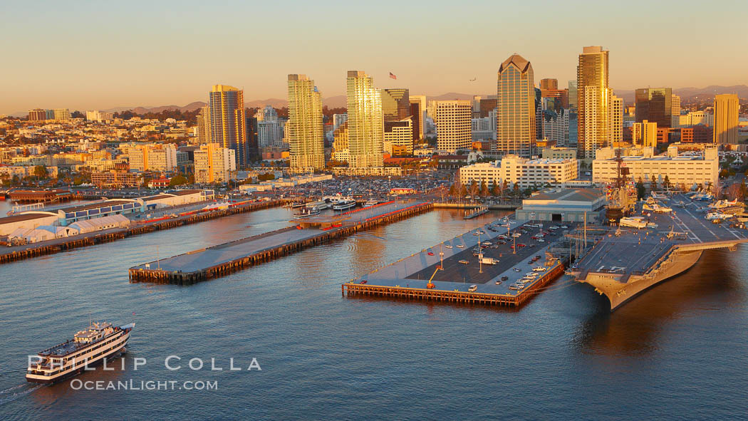 Downtown San Diego bayfront, Marina District, with the USS Midway Navy aircraft carrier (right), cruise ship terminal (left) and high rise office buildings towering over North Harbor Drive along San Diego Bay. California, USA, natural history stock photograph, photo id 22308