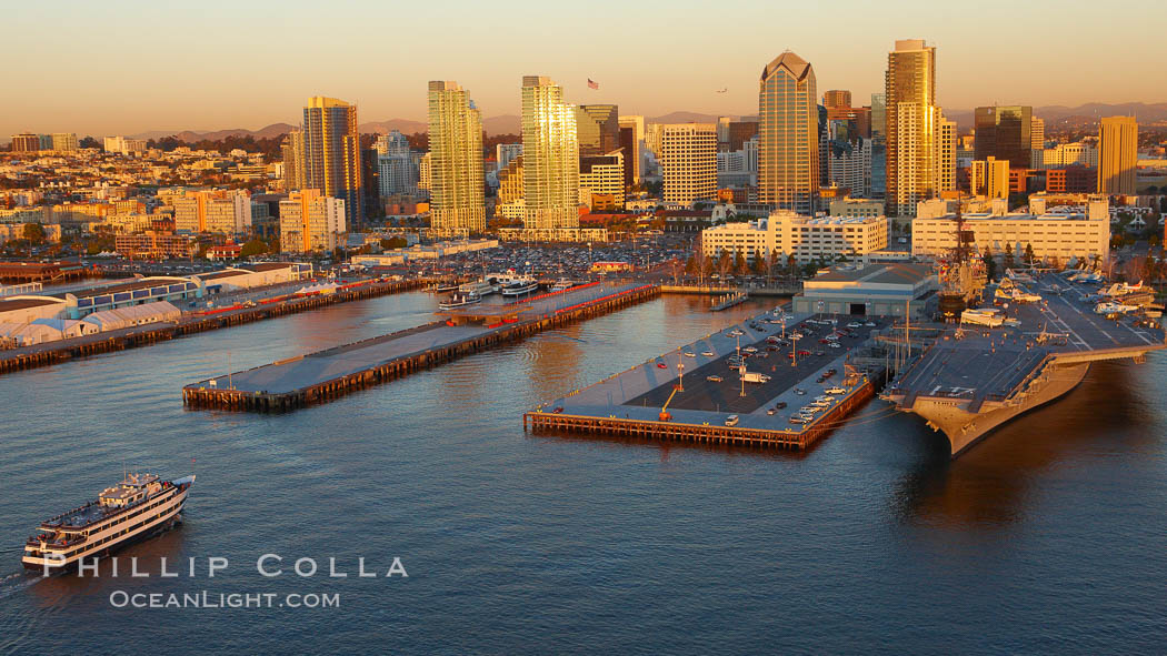 Downtown San Diego bayfront, Marina District, with the USS Midway Navy aircraft carrier (right), cruise ship terminal (left) and high rise office buildings towering over North Harbor Drive along San Diego Bay. California, USA, natural history stock photograph, photo id 22403