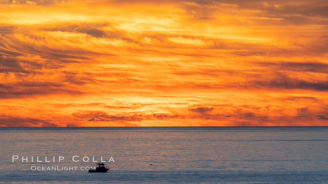 Fiery Sunset and Fishing Boat at Sea, Carlsbad. California, USA, natural history stock photograph, photo id 37481