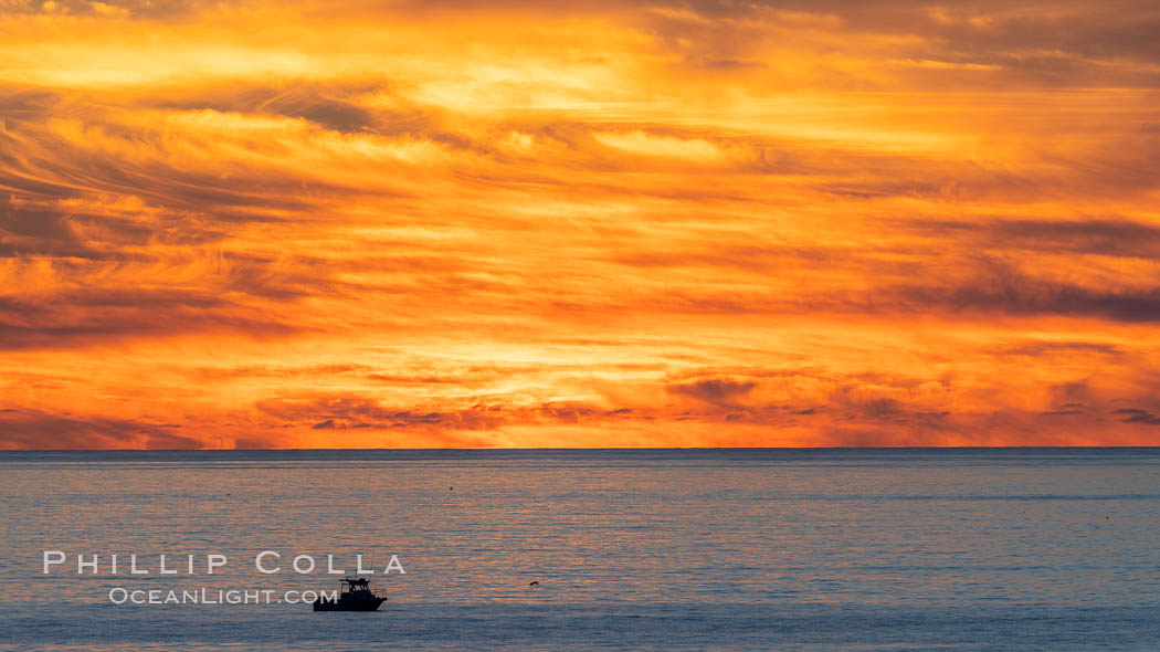 Fiery Sunset and Fishing Boat at Sea, Carlsbad. California, USA, natural history stock photograph, photo id 37481