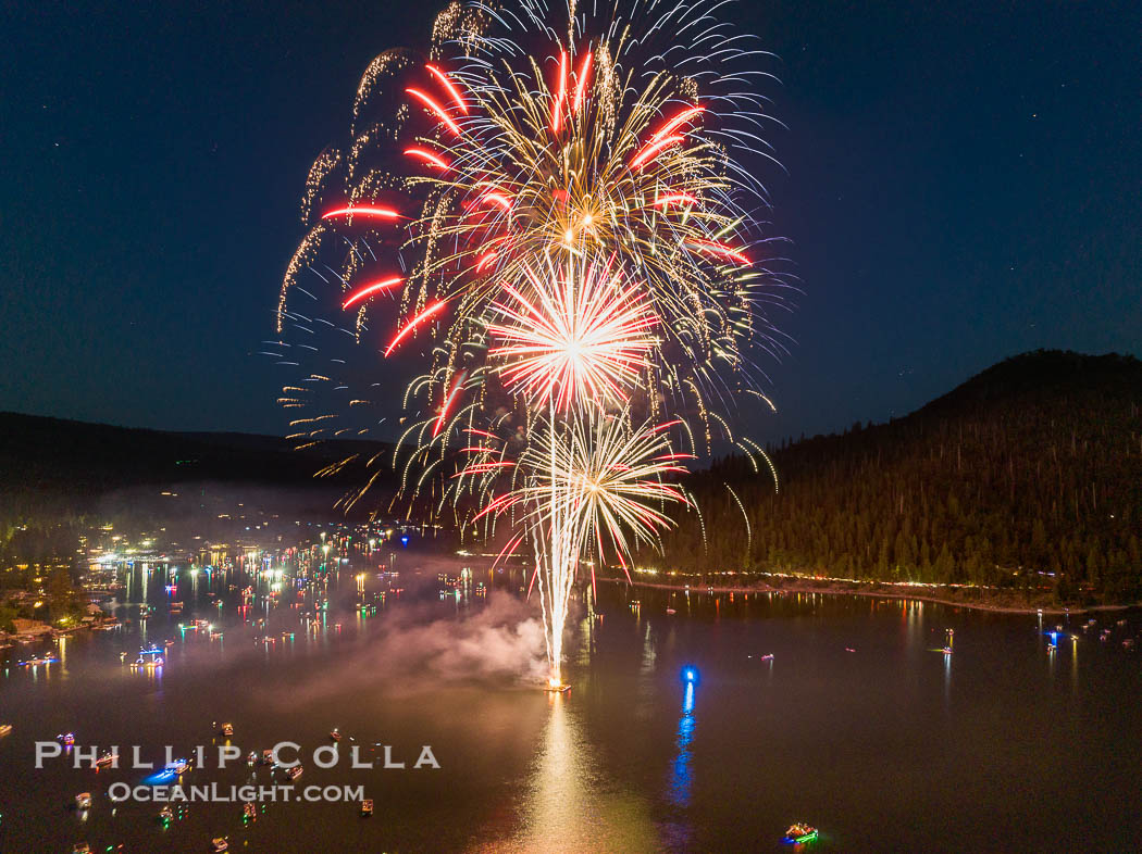Fireworks over Bass Lake on the Fourth of July.  Each summer, boaters gather on beautiful Bass Lake to enjoy a display of Fourth of July fireworks over the lake, near Yosemite and Oakhurst in the western Sierra Nevada. Aerial photo. California, USA, natural history stock photograph, photo id 39781
