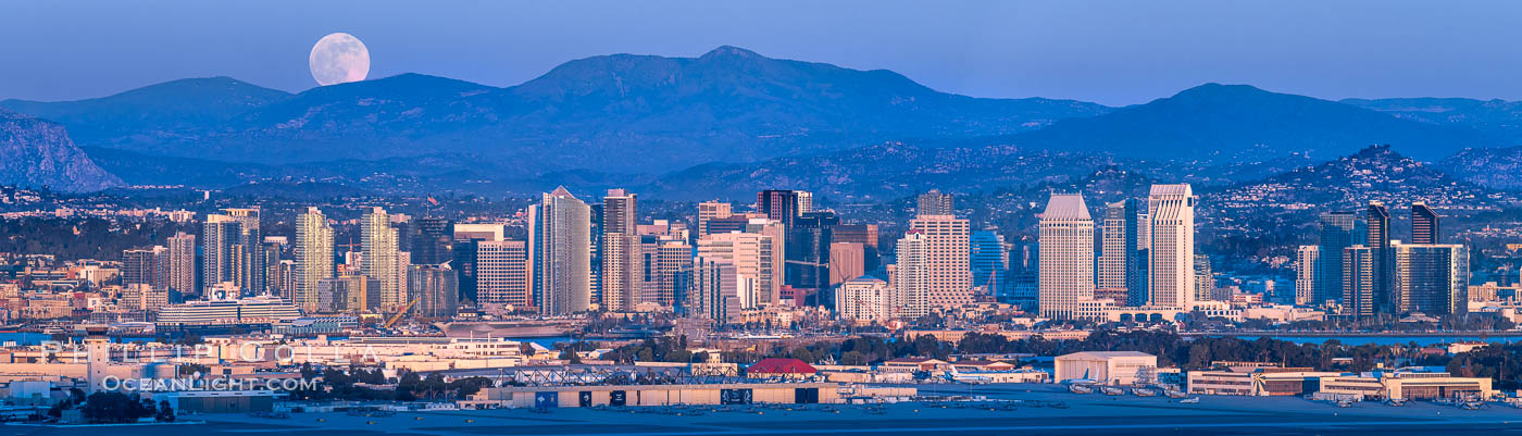 Full Moon Rises over San Diego City Skyline and Mount Laguna, viewed from Point Loma, panoramic photograph. The mountains east of San Diego can be clearly seen when the air is cold, dry and clear as it is in this photo