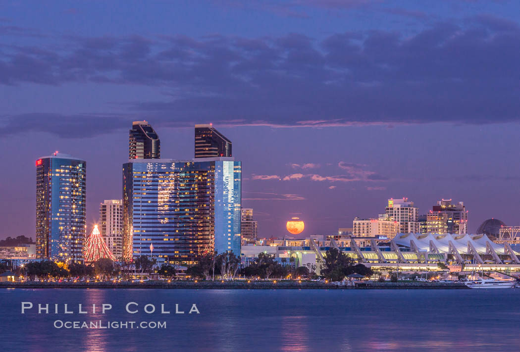 Full moon rising over San Diego city skyline, sunset, storm clouds, viewed from Coronado Island. California, USA, natural history stock photograph, photo id 28026