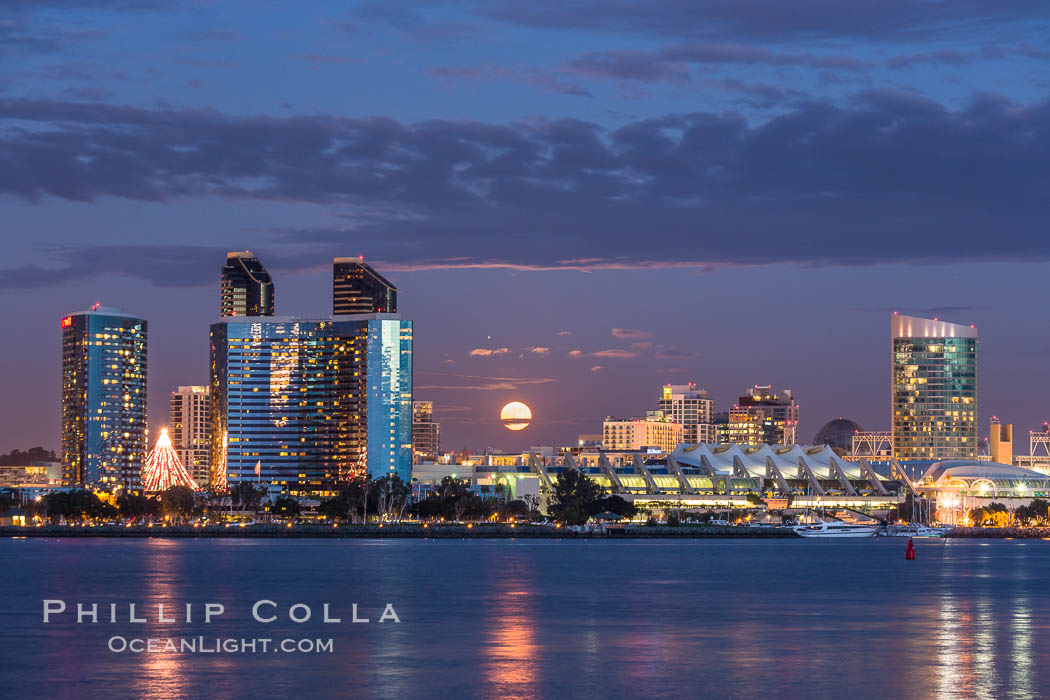 Full moon rising over San Diego city skyline, sunset, storm clouds, viewed from Coronado Island. California, USA, natural history stock photograph, photo id 28023