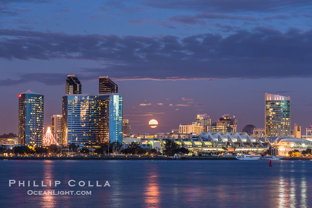 Full moon rising over San Diego city skyline, sunset, storm clouds, viewed from Coronado Island., natural history stock photograph, photo id 28023