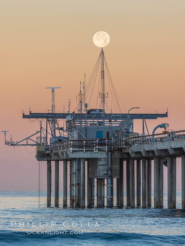 Full Moon Setting Over SIO Pier in the moments just before sunrise, Scripps Institution of Oceanography, La Jolla, California