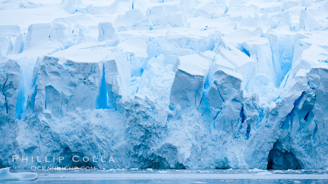 A glacier fractures and cracks, as the leading of a glacier fractures and cracks as it reaches the ocean.  The pieces will float away to become icebergs. Neko Harbor, Antarctic Peninsula, Antarctica, natural history stock photograph, photo id 25743