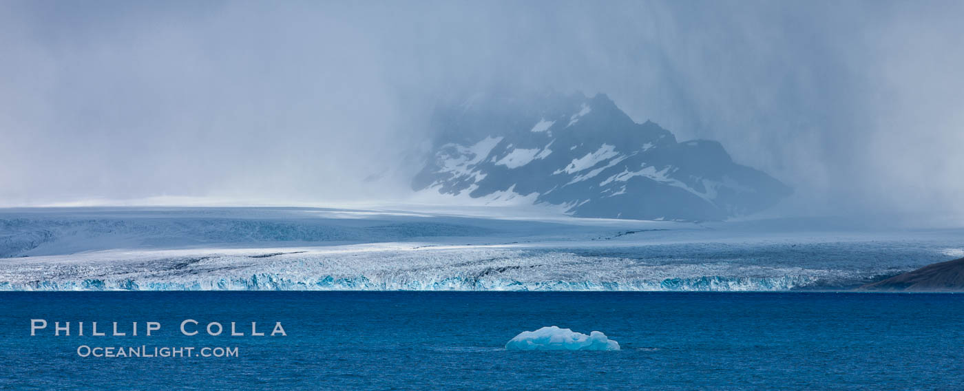 Glacier and iceberg, Cumberland Bay, near Grytviken. South Georgia Island, natural history stock photograph, photo id 24551